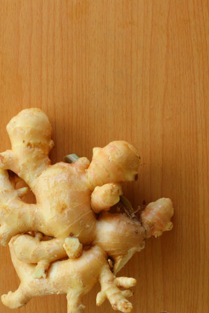 Ginger on wood background 