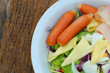 Salad on wood background の写真素材