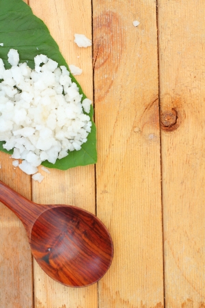 Sea salt on wood backgroundの写真素材