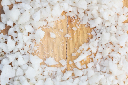 Sea salt on wood backgroundの写真素材