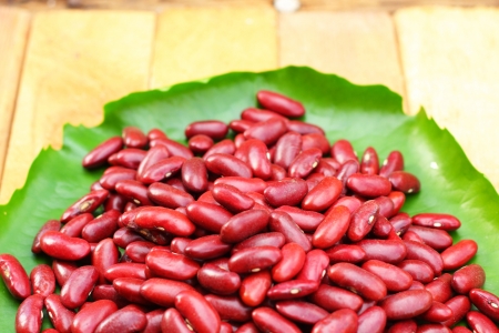 Dried red beans on a wood backgroundの写真素材