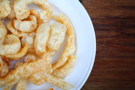 Fried Pork Skin on wood -  pork snack