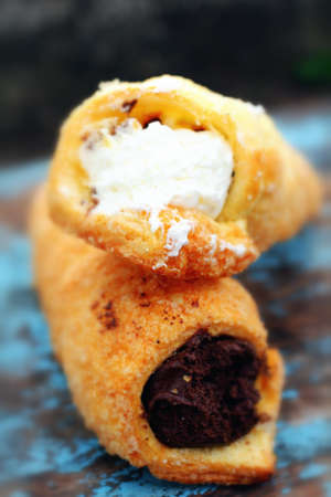 pie roll with cream on wood backgroundの写真素材