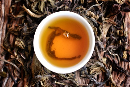 Hot tea on the wood background - Chinese style.の写真素材