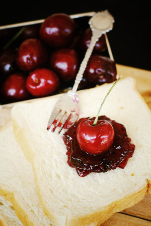 Cherry jam and fresh ripe cherries