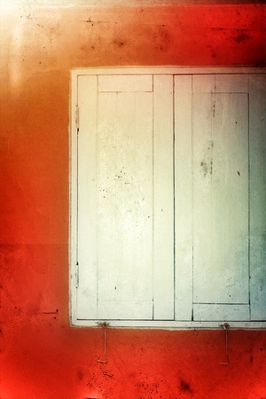 Vintage style window on orange wallの写真素材