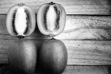 Kiwi fruite on wood backgroundの写真素材