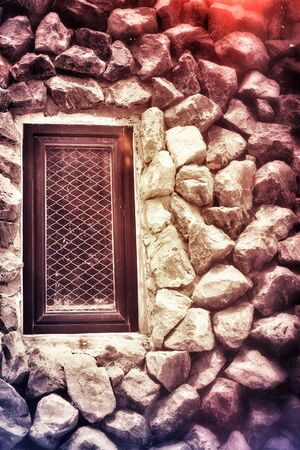 Window on the stone wallの写真素材