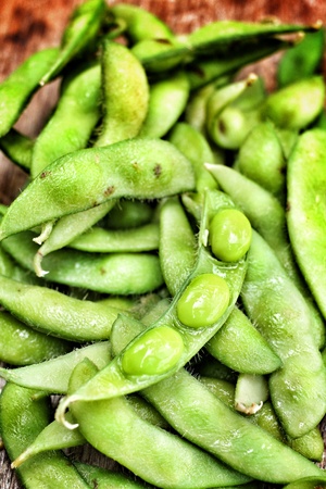 Green fresh soybeans on wood backgroundの写真素材