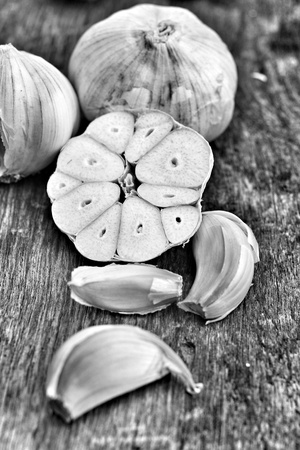 Garlic on the brown wood backgroundの写真素材
