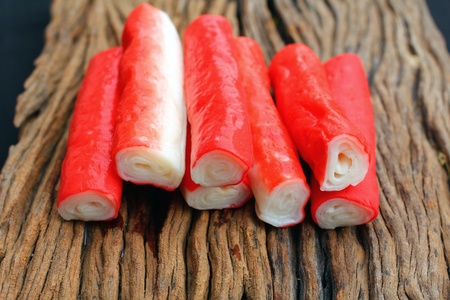 crab sticks on wood backgroundの写真素材
