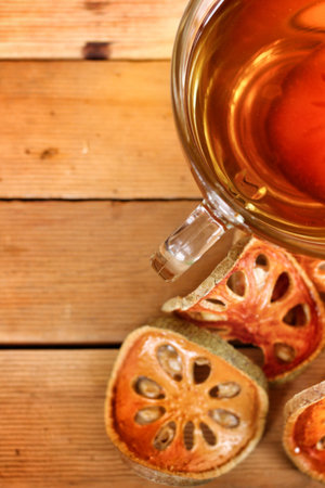 Slices of dried bael fruit and teaの写真素材