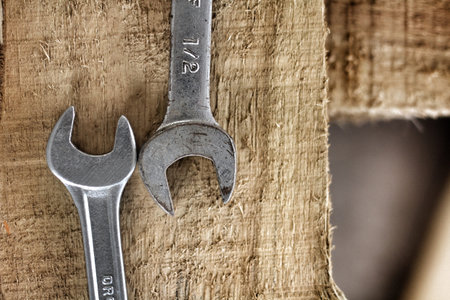 Socket wrench and screw on wood
