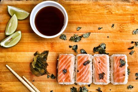 Salmon sushi on the wood backgroundの写真素材