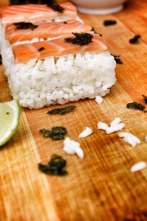 Salmon sushi on the wood backgroundの写真素材