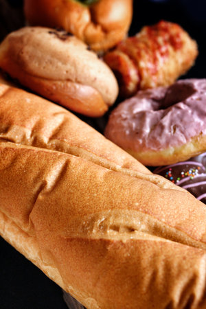 Bakery foodstuffs set on wood background
