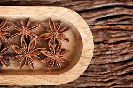 Star anise on wood backgroundの写真素材