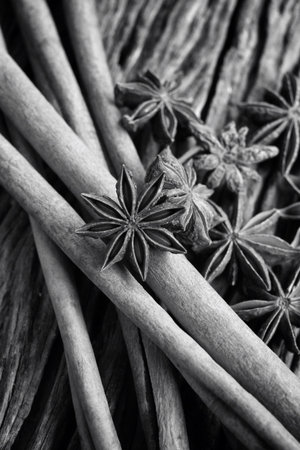 Star anise and cinnamon on wood background