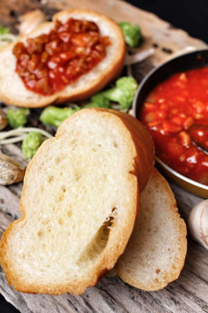 Spaghetti and tomato sauce with french breadの写真素材