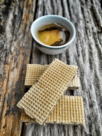 Close up delicious wafer chocolate and hot tea