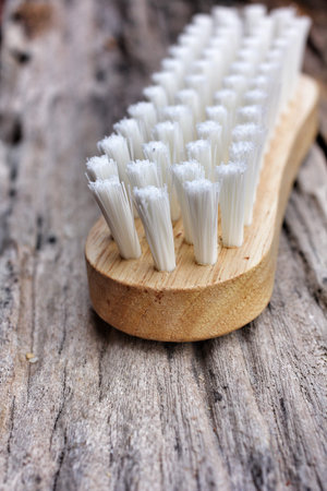 clothes cleaning brush on wood