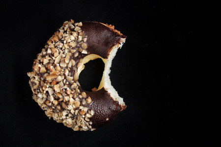 Chocolate donut on black の写真素材