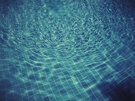 Blue swimming pool rippled water detailの写真素材