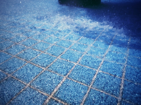 Blue swimming pool rippled water detailの写真素材