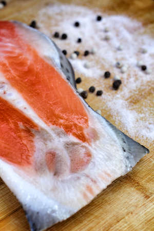 Fresh salmon with salt and pepperの写真素材