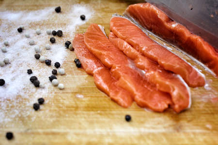 Fresh salmon with salt and pepperの写真素材