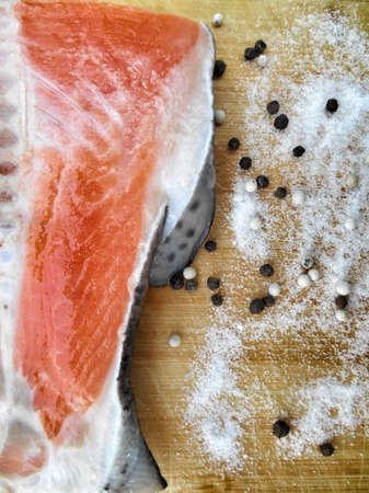 Fresh salmon with salt and pepperの写真素材