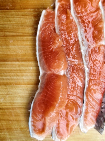 Fresh salmon on wood backgroundの写真素材