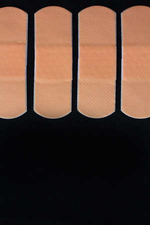 Medical adhesive bandage on black の写真素材