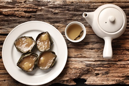 Steamed dessert of Chinese New Year and  hot teaの写真素材