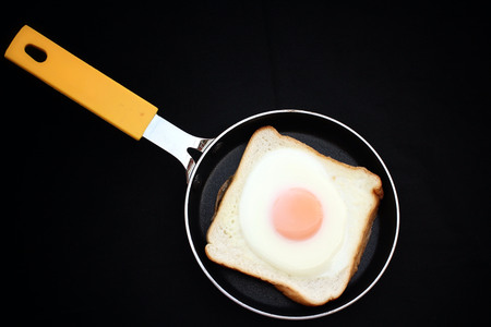 Making breakfast with fresh eggsの写真素材