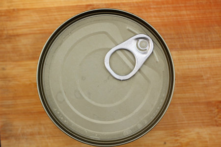 Tin can on wood background