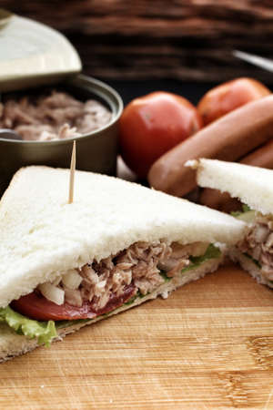 making tuna sandwich on cutting boardの写真素材