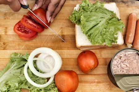 making tuna sandwich on cutting boardの写真素材