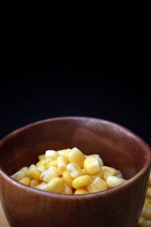 canned corn in the bowlの写真素材