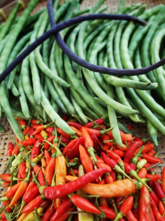 Chili and long beans in the market.の写真素材