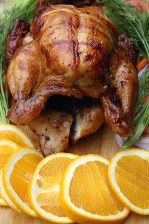 Whole roasted chicken with fresh vegetables for thanksgiving dayの写真素材