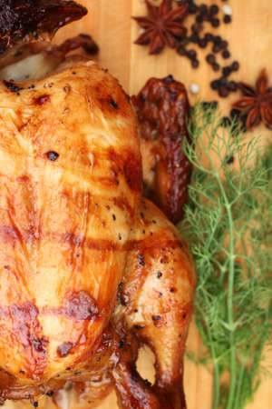 Whole roasted chicken with fresh vegetables for thanksgiving dayの写真素材