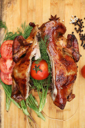 Whole roasted chicken with fresh vegetables for thanksgiving dayの写真素材