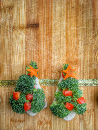 Christmas tree of bread  broccoli and tomatoes for christmas foodの写真素材