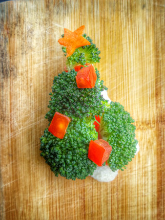 Christmas tree of bread  broccoli and tomatoes for christmas foodの写真素材