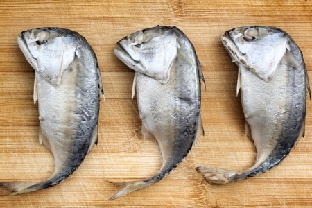 Steamed mackerel fish cutting board.の写真素材