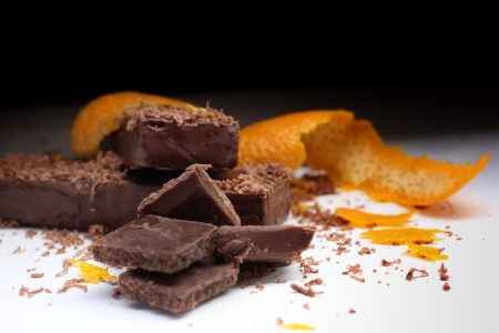 Close-up of chocolate pieces and orange peel.の写真素材