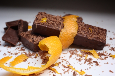 Close-up of chocolate pieces and orange peel.の写真素材