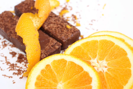 Close-up of chocolate pieces and orange peel.の写真素材