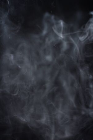 Smoke fragments on a black backgroundの写真素材